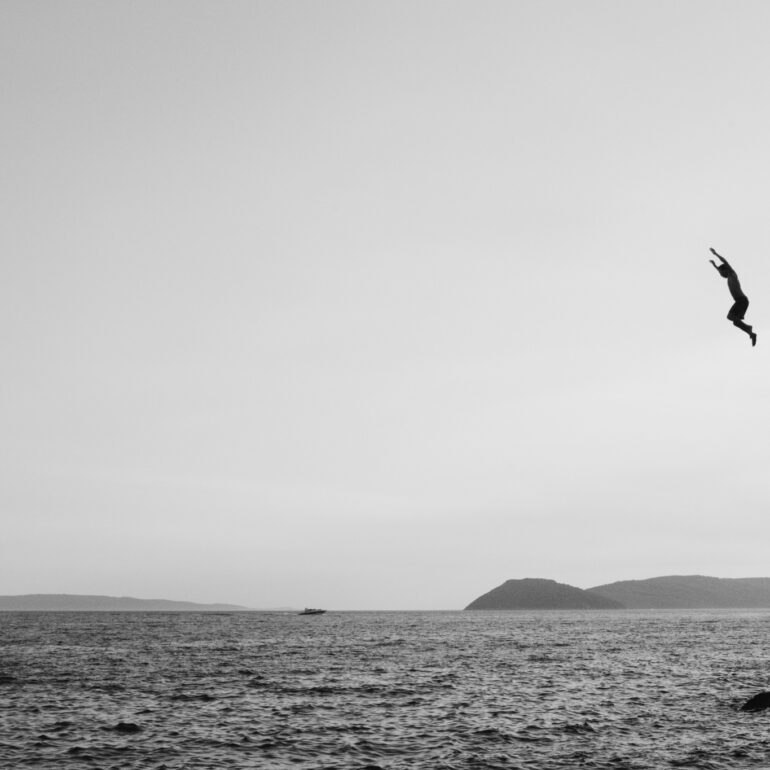 Cliff Jumping in Spilt Croatia - People Diving In Sea during Clear Sky